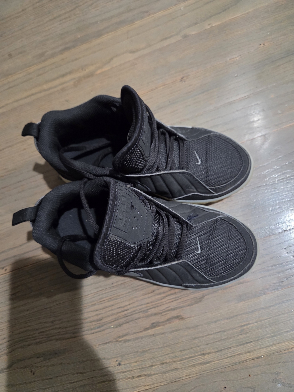 Nike Kids Black Athletic Sneakers with Subtle White Accents